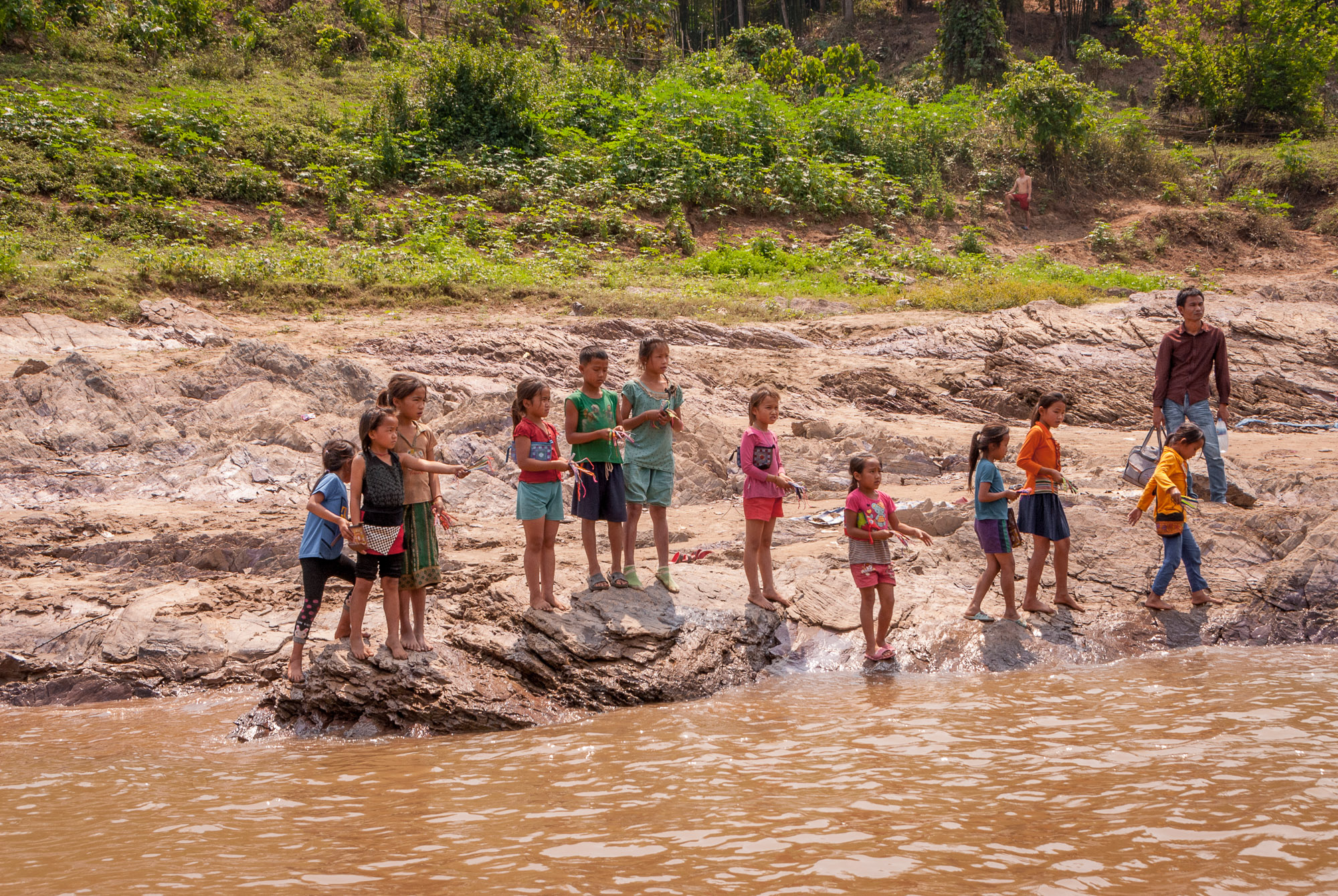 children at river's edge
